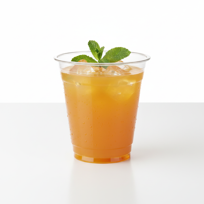 Vaso cónico transparente 12-14 oz con jugo de naranja, hielo y menta